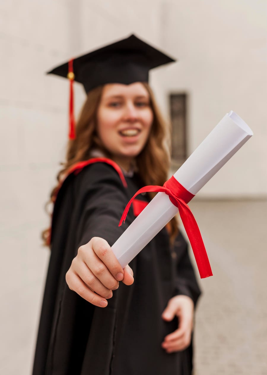 Graduate holding her diploma